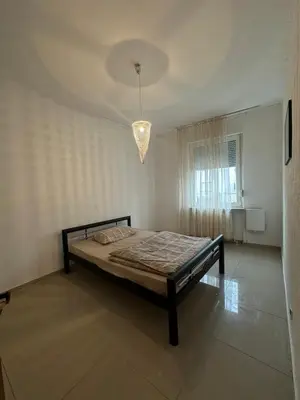 Ein Bett oder Betten in einem Zimmer der Unterkunft Shekinah Residences near Frankfurt Airport