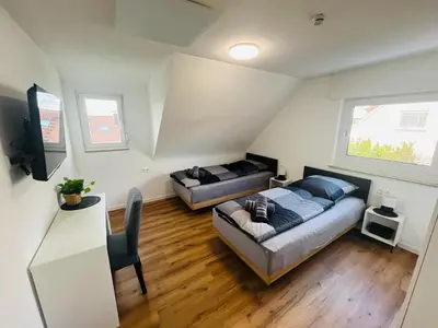Ein Bett oder Betten in einem Zimmer der Unterkunft Schönblick modernes Gästehaus mit Panoramablick