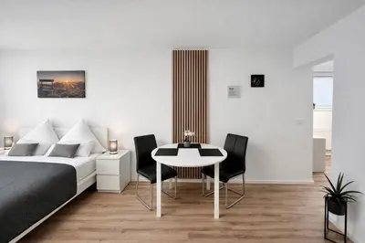 Ein Bett oder Betten in einem Zimmer der Unterkunft WINETIME - Apartment Roschbach - für bis zu 2 Personen - idyllisch an den Weinbergen der südlichen Weinstraße zwischen Landau und Neustadt gelegen