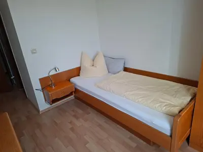 Ein Bett oder Betten in einem Zimmer der Unterkunft Gästezimmer Hagenschieß