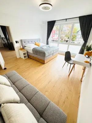 Ein Bett oder Betten in einem Zimmer der Unterkunft NIRO I Design City Apartment, Wellness, Infrarotkabine, Parkplatz, TV