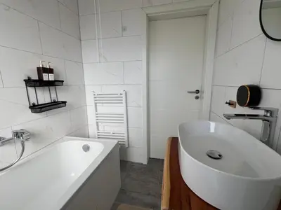 Ein Badezimmer in der Unterkunft Traumhafte 3 Zimmer Ferienwohnung mit Balkon