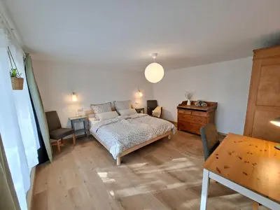 Ein Bett oder Betten in einem Zimmer der Unterkunft Ferienwohnung Luise unterhalb der Burg Lindenfels