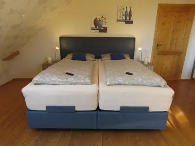 Ein Bett oder Betten in einem Zimmer der Unterkunft Das blaue Haus