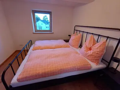 Ein Bett oder Betten in einem Zimmer der Unterkunft Ferienwohnung Beim Schorsch