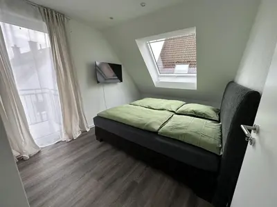 Ein Bett oder Betten in einem Zimmer der Unterkunft New construction attic apartment top amenities