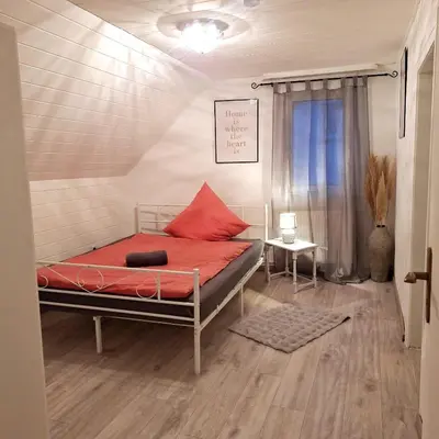 Ein Bett oder Betten in einem Zimmer der Unterkunft Ferienwohnung Ferienhaus Wörrstadt
