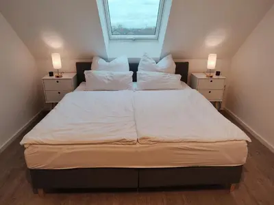 Ein Bett oder Betten in einem Zimmer der Unterkunft Bruchsal Business Apartment - Schreibtisch - Smart-TV