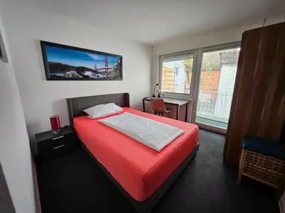Ein Bett oder Betten in einem Zimmer der Unterkunft Gästehaus Schröder