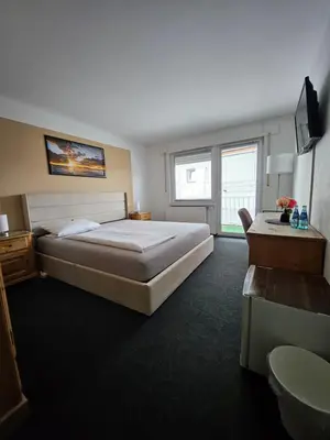 Ein Bett oder Betten in einem Zimmer der Unterkunft Gästehaus Schröder