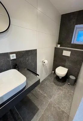 Ein Badezimmer in der Unterkunft Ferienwohnung Tee - Time - Lodge und Kirsch - Kiste