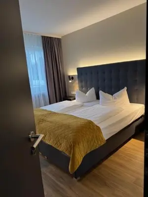 Ein Bett oder Betten in einem Zimmer der Unterkunft Vinotel Dirmstein