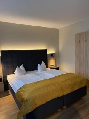 Ein Bett oder Betten in einem Zimmer der Unterkunft Vinotel Dirmstein