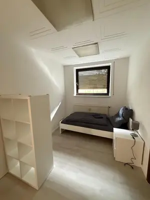 Ein Bett oder Betten in einem Zimmer der Unterkunft RO1 - Gepflegte Unterkunft Nahe Frankfurt