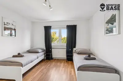 Ein Bett oder Betten in einem Zimmer der Unterkunft MONTEUR - Unterkunft für bis zu 6 Personen in 63128 Dietzenbach - OF05