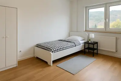 Ein Bett oder Betten in einem Zimmer der Unterkunft Monteur- und Ferienwohnung Bensheim