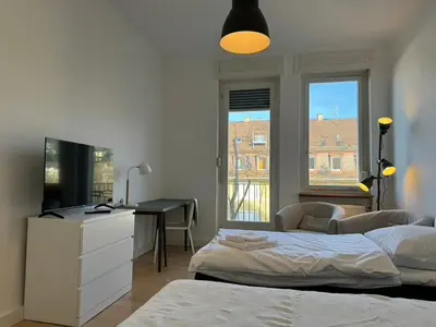 Ein Bett oder Betten in einem Zimmer der Unterkunft 6 Einzelbetten - 4 Zimmer - eigener PARKPLATZ - Balkon