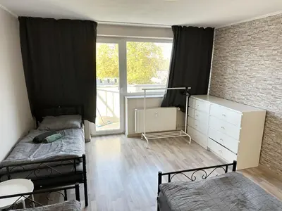 Ein Bett oder Betten in einem Zimmer der Unterkunft Work and Stay near Frankfurt Airport 2BR and Balcony