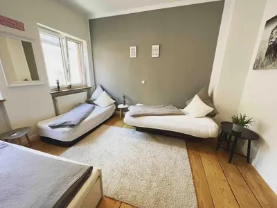Ein Bett oder Betten in einem Zimmer der Unterkunft Altbauwohnung mit Dachterrasse in der Innenstadt Speyer