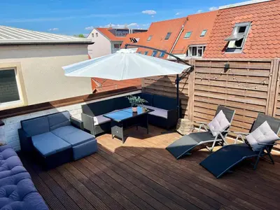 Ein Sitzbereich in der Unterkunft Altbauwohnung mit Dachterrasse in der Innenstadt Speyer