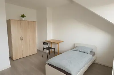 Ein Bett oder Betten in einem Zimmer der Unterkunft Monteur- und Ferienwohnung Maxdorf
