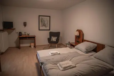 Ein Bett oder Betten in einem Zimmer der Unterkunft Pension Hubertushof