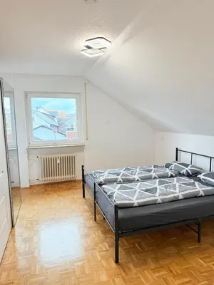 Ein Bett oder Betten in einem Zimmer der Unterkunft Ferienwohnung DG Barbara Stauder