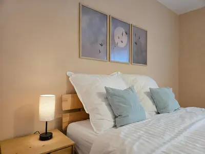 Ein Bett oder Betten in einem Zimmer der Unterkunft The Blue House