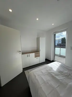 Ein Bett oder Betten in einem Zimmer der Unterkunft Modern new-build apartment