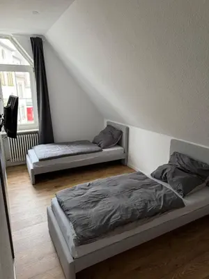 Ein Bett oder Betten in einem Zimmer der Unterkunft Zweistöckige Wohnung im weissen Lamm