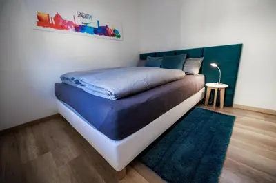 Ein Bett oder Betten in einem Zimmer der Unterkunft Stylishes Premium Apartment