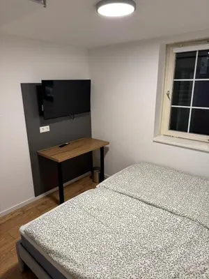 Ein Bett oder Betten in einem Zimmer der Unterkunft Große Wohneinheit Im Hotel weisses Lamm