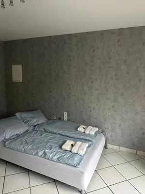 Ein Bett oder Betten in einem Zimmer der Unterkunft Modern 2-room apartment with large kitchen