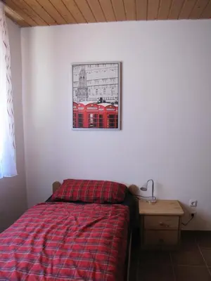 Ein Bett oder Betten in einem Zimmer der Unterkunft Feriendomizil Weinheim