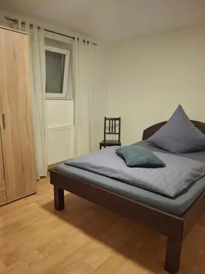 Ein Bett oder Betten in einem Zimmer der Unterkunft Perfekt für Firmen, Pendler, berufliche Übernachtungen