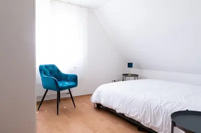 Ein Bett oder Betten in einem Zimmer der Unterkunft G-Living Louis-Hentges32 City & Work Apartment