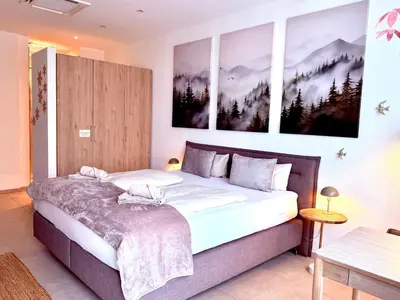 Ein Bett oder Betten in einem Zimmer der Unterkunft Pfalzliebe Suites - Suite Franz, Landau Zentrum