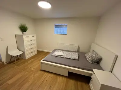 Ein Bett oder Betten in einem Zimmer der Unterkunft Moderne Ferienwohnung zentral in Hemsbach