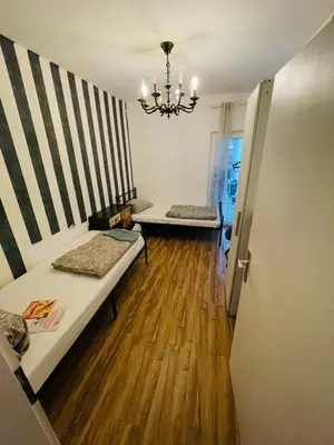 Ein Bett oder Betten in einem Zimmer der Unterkunft House A44