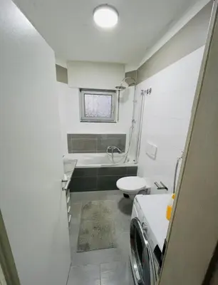 Ein Badezimmer in der Unterkunft House A44