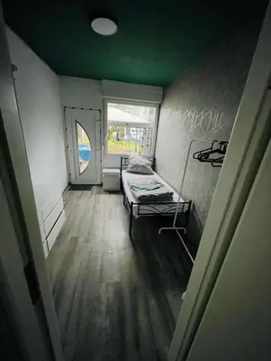 Ein Bett oder Betten in einem Zimmer der Unterkunft House A44