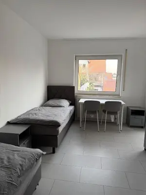 Ein Bett oder Betten in einem Zimmer der Unterkunft Monteurwohnung Lampertheim