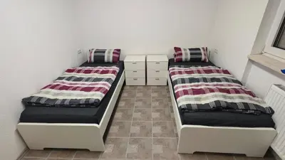 Ein Bett oder Betten in einem Zimmer der Unterkunft Urlaub am Rhein Speyer Hockenheim Mannheim