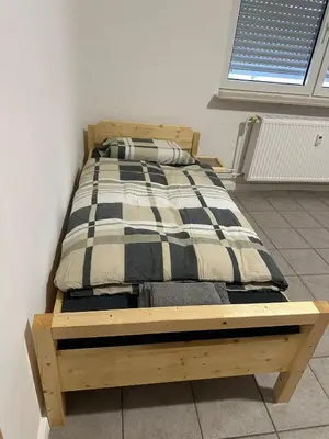 Ein Bett oder Betten in einem Zimmer der Unterkunft Monteurunterkunft in ruhiger Lage, nahe Zentrum