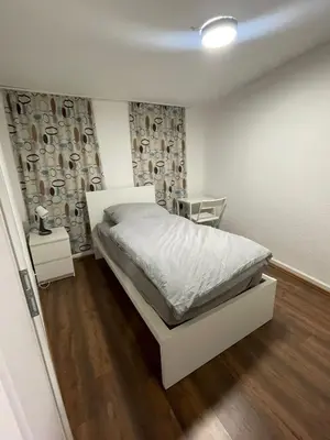 Ein Bett oder Betten in einem Zimmer der Unterkunft Haus zum Bacchus Privates Einzelzimmer nahe Bahnhof Römisches Theater, Mainz