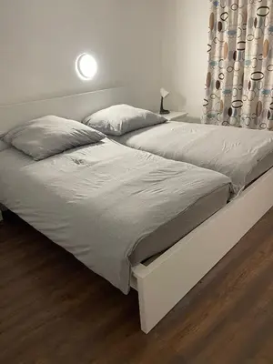 Ein Bett oder Betten in einem Zimmer der Unterkunft Haus zum Bacchus Privatezimmer near Bahnhof Römisches Theater Mainz
