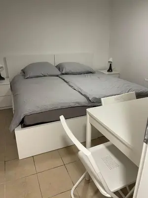 Ein Bett oder Betten in einem Zimmer der Unterkunft Haus zum Bacchus Privatezimmer near Bahnhof Römisches Theater Mainz