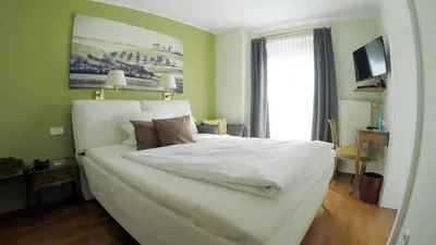 Ein Bett oder Betten in einem Zimmer der Unterkunft Hotel Prinz Carl
