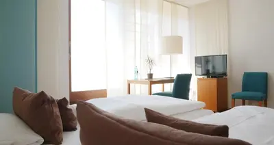 Ein Bett oder Betten in einem Zimmer der Unterkunft Hotel Prinz Carl
