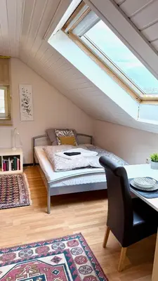 Ein Bett oder Betten in einem Zimmer der Unterkunft Domus Palatina FeWo & Business Apartments